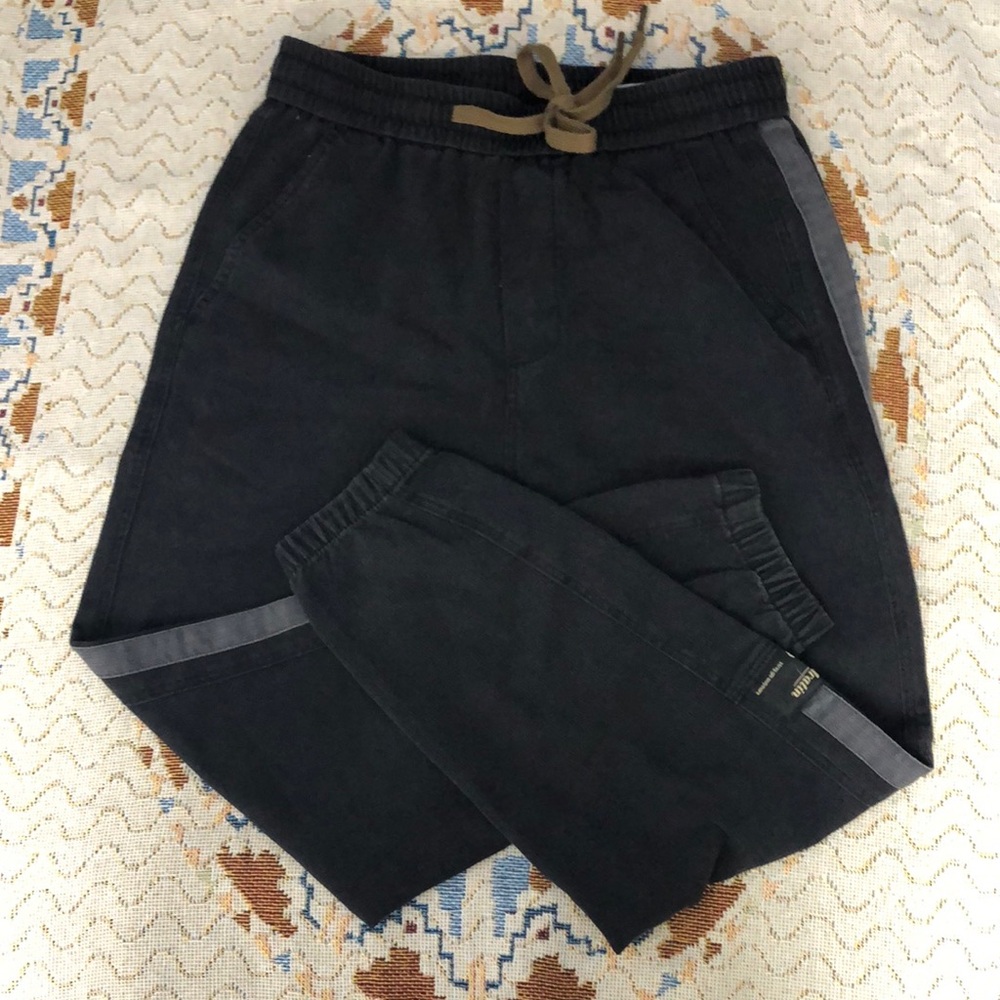 Black Sweatpants with Reflective Accents and Tapered Fit